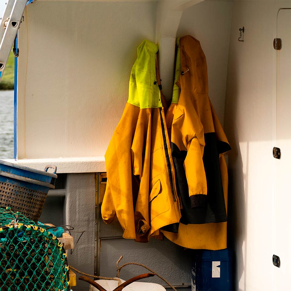 Waterproof coats hung on boat